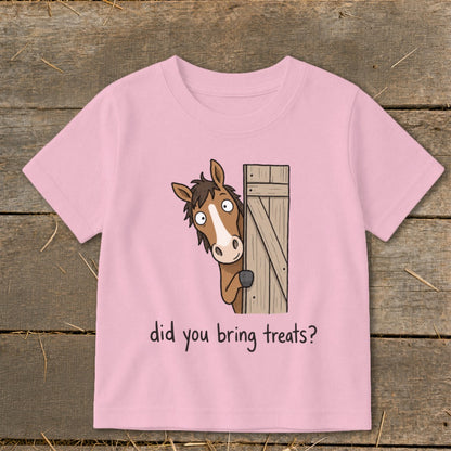 Pink t-shirt with cartoon horse peeking from behind a gate asking, "did you bring treats?"
