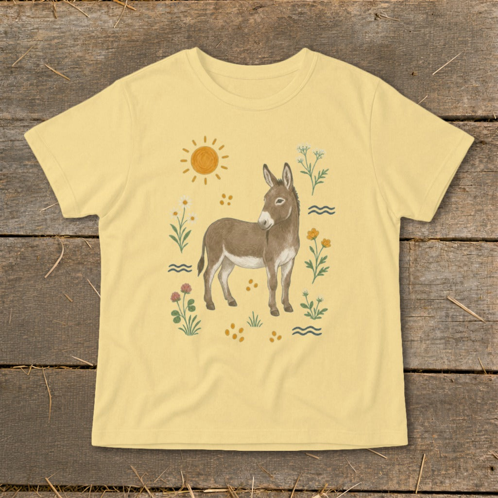Yellow t-shirt with a brown donkey illustration surrounded by flowers and sun.