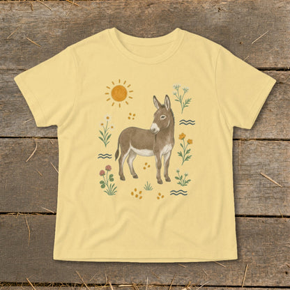 Yellow t-shirt with a brown donkey illustration surrounded by flowers and sun.