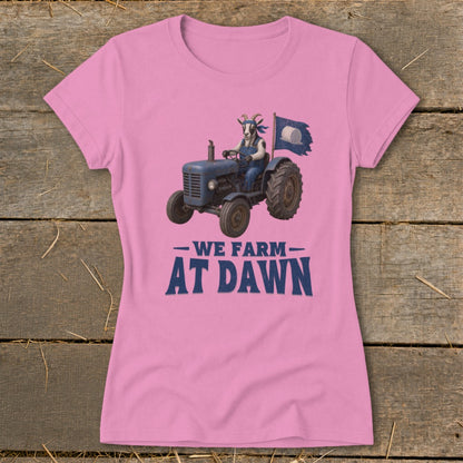 Goat driving a blue tractor with a flag, "We Farm At Dawn" text.