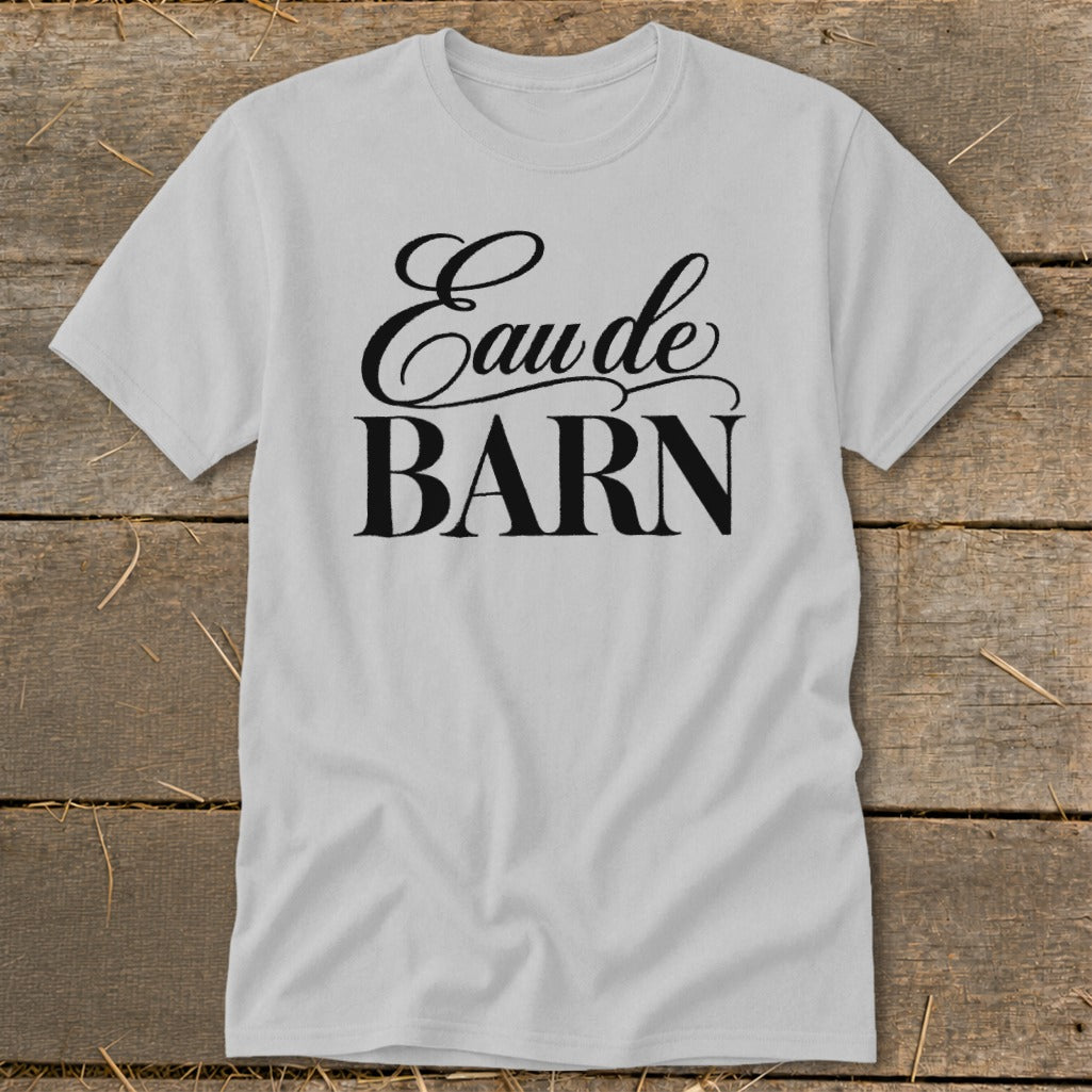 Gray t-shirt with "Eau de BARN" text in black cursive and block letters.