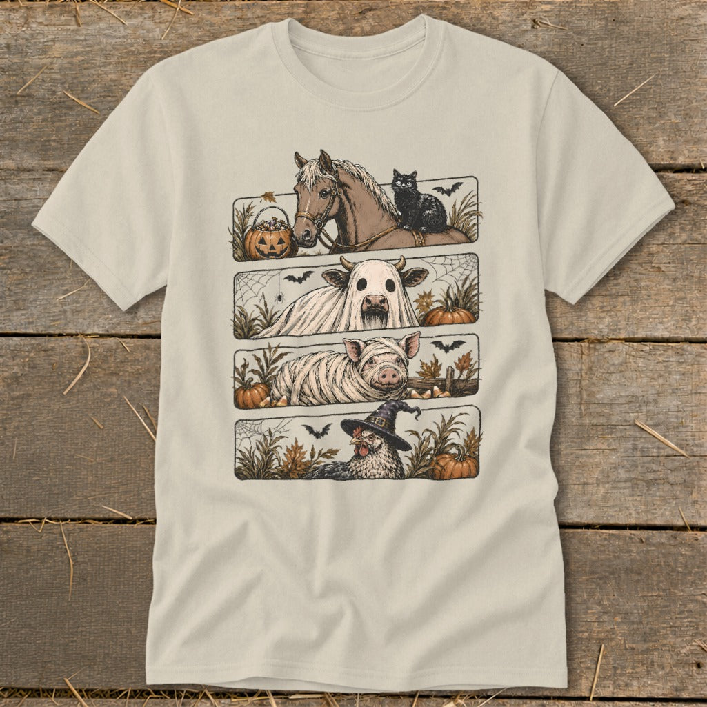 Four Halloween-themed farm animals on a light-colored t-shirt: horse, cow, pig, and chicken.