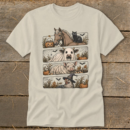 Four Halloween-themed farm animals on a light-colored t-shirt: horse, cow, pig, and chicken.
