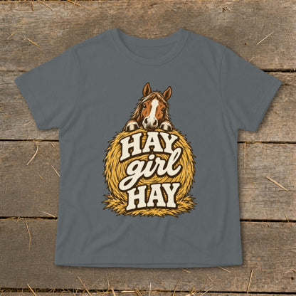 Horse peeking over hay bale with text "HAY girl HAY".