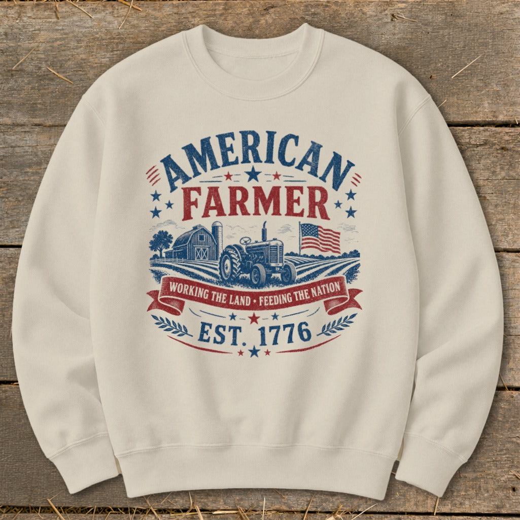 Cream sweatshirt with American Farmer graphic: tractor, barn, flag, est. 1776.