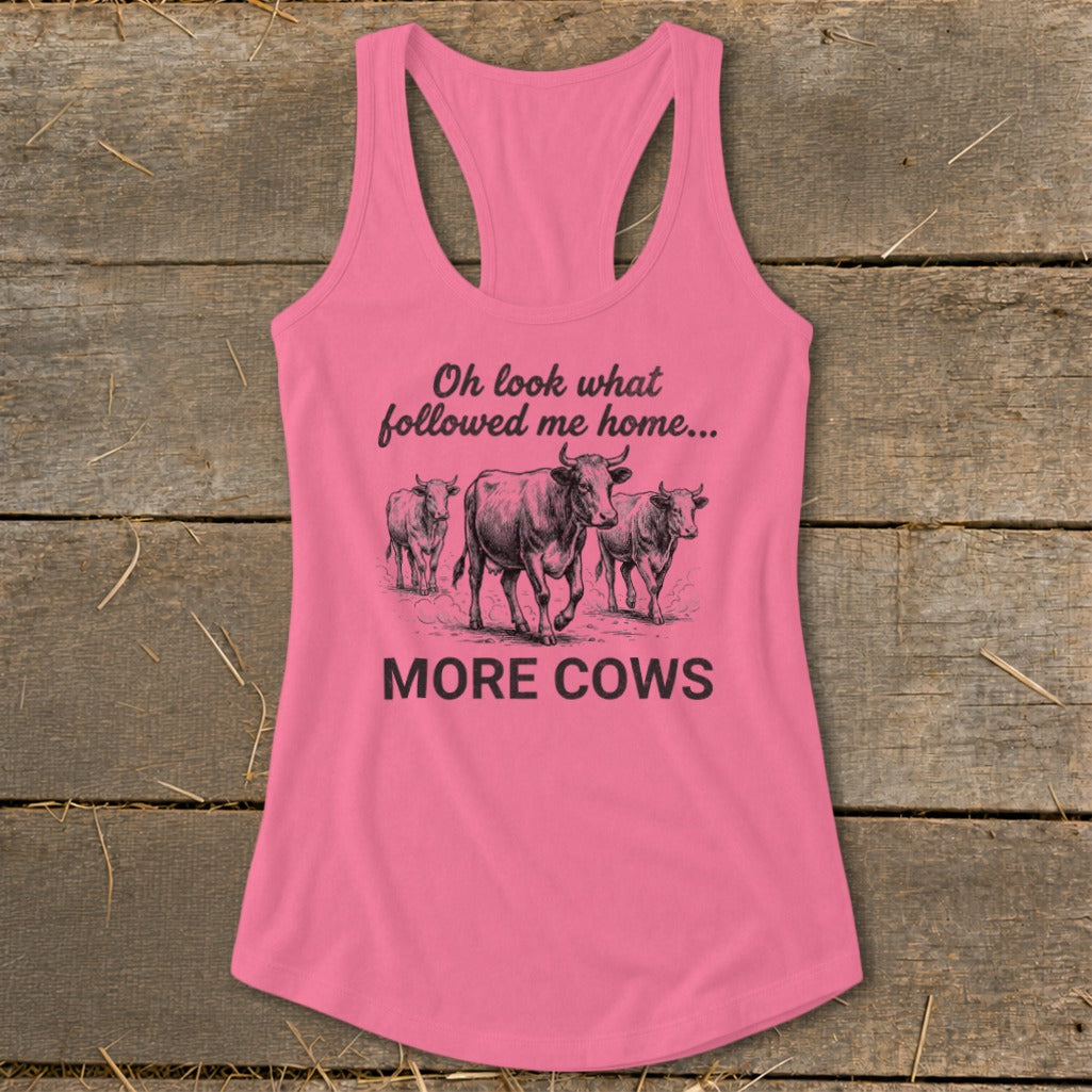Pink tank top with "Oh look what followed me home... MORE COWS" and cow graphic.