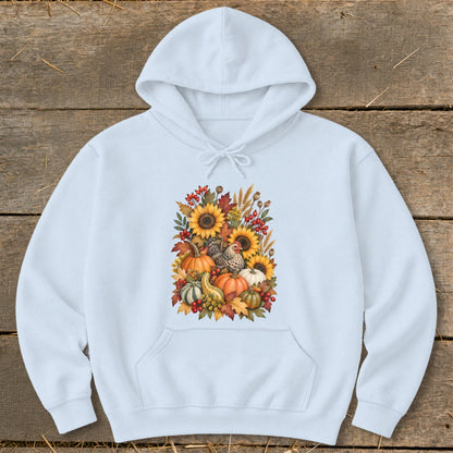 Light blue hoodie with a fall harvest graphic featuring chickens, pumpkins, and sunflowers.