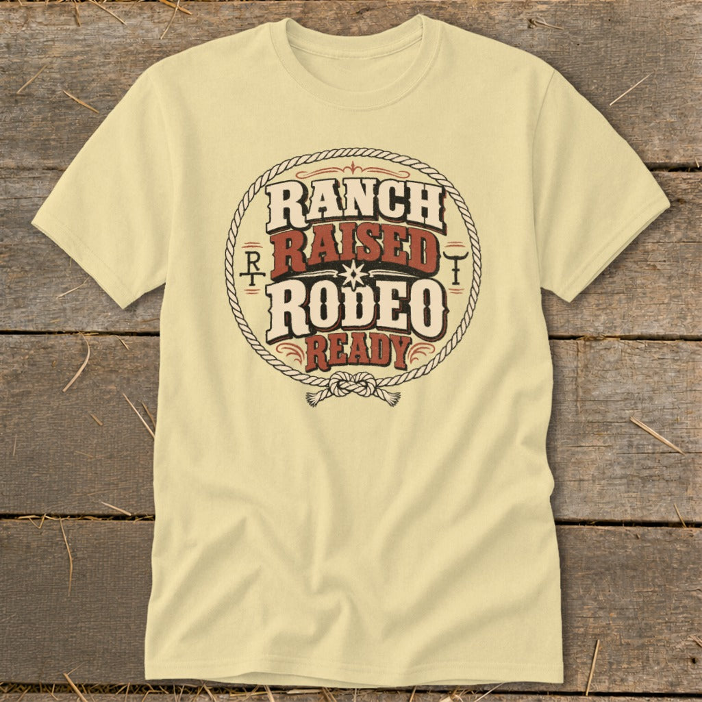 Light yellow t-shirt with "Ranch Raised Rodeo Ready" graphic in distressed circular rope design.