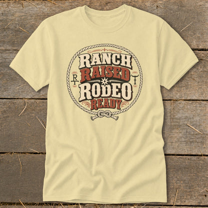 Light yellow t-shirt with "Ranch Raised Rodeo Ready" graphic in distressed circular rope design.
