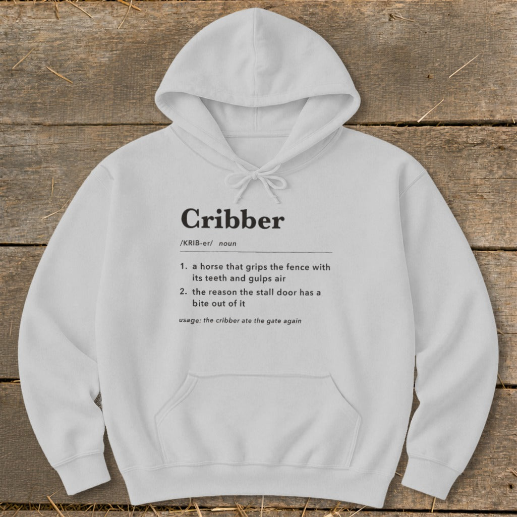 A light gray hooded sweatshirt with dictionary definitions of the word cribber printed on the chest.