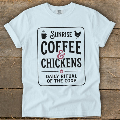 White t-shirt with "Sunrise Coffee & Chickens Daily Ritual of the Coop" graphic.