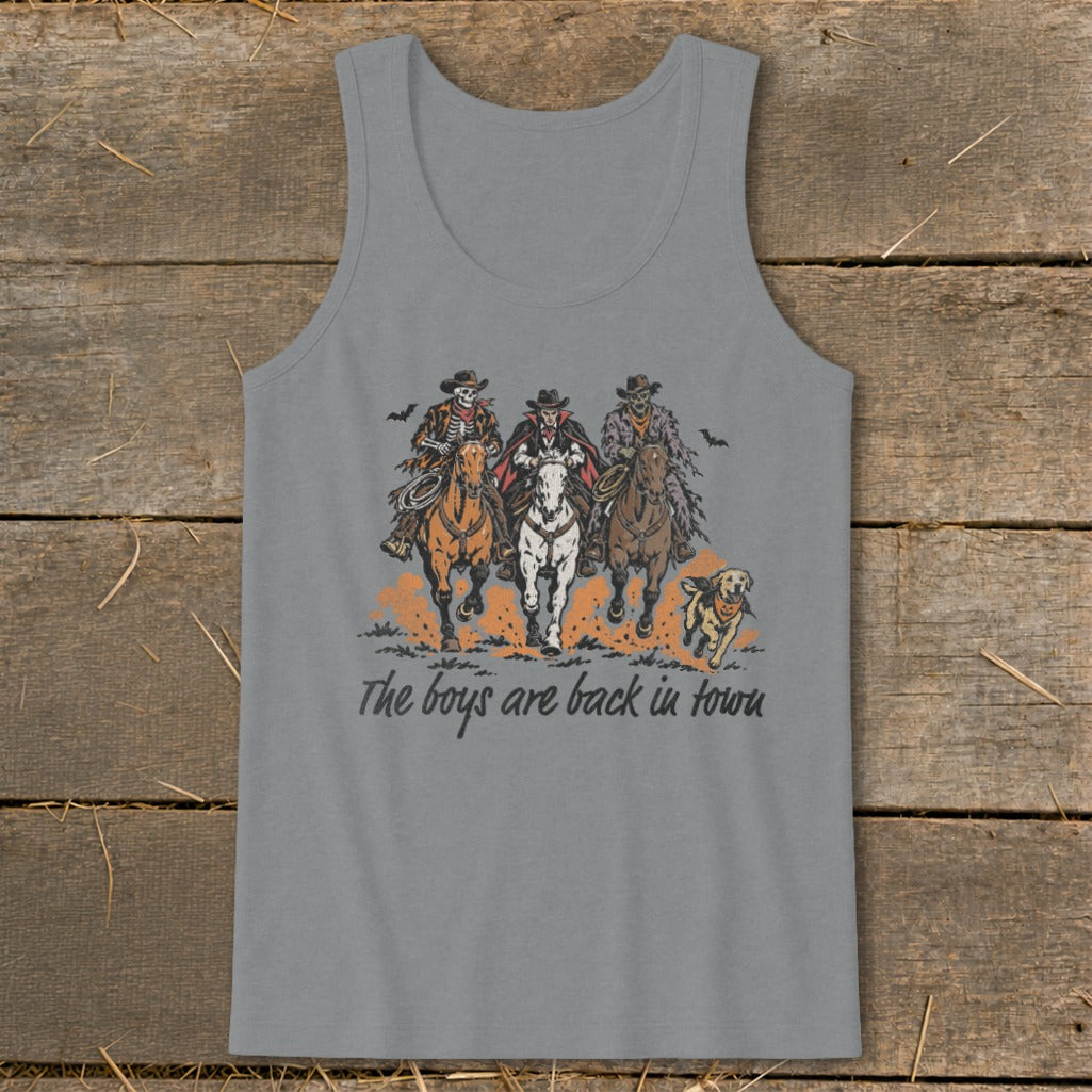 Three skeletal cowboys ride horses with a vampire, a dog runs alongside.