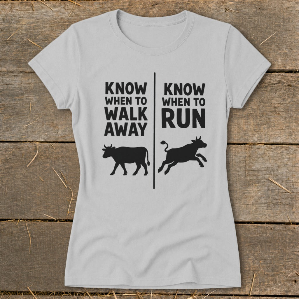 Light grey t-shirt with black text and cow graphics: "Know When to Walk Away" and "Know When to Run."