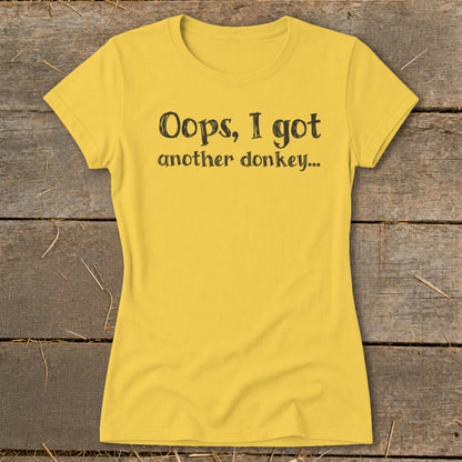 Yellow t-shirt with "Oops, I got another donkey..." text in black.