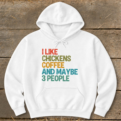 White hoodie with text "I LIKE CHICKENS COFFEE AND MAYBE 3 PEOPLE" in multi-color.