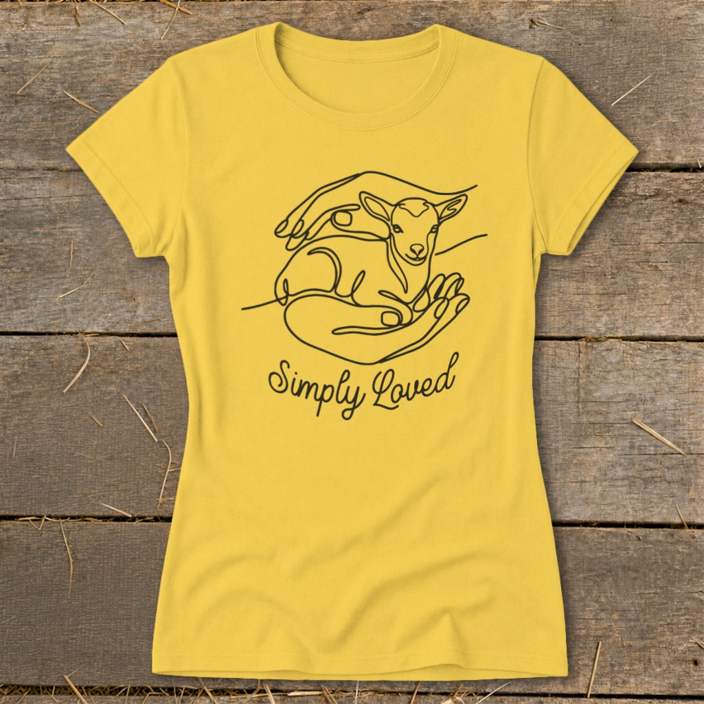 Yellow t-shirt with line art of hands holding a lamb and text "Simply Loved".