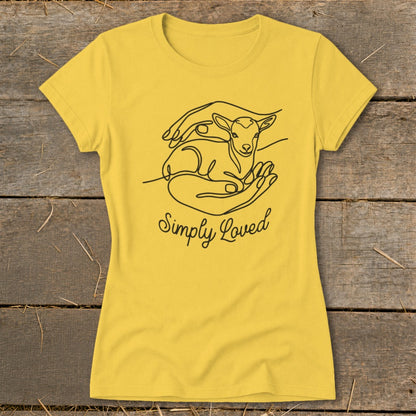 Yellow t-shirt with line art of hands holding a lamb and text "Simply Loved".