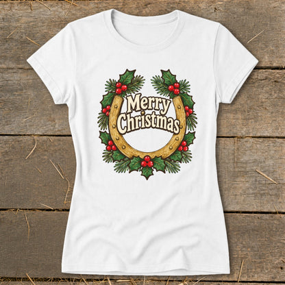 White t-shirt with a Christmas wreath graphic featuring a horseshoe and "Merry Christmas" text.