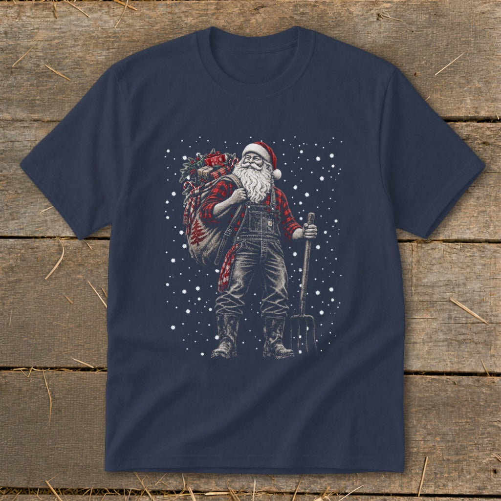 T-shirt graphic of Santa in overalls with a sack and pitchfork, surrounded by snowflakes.