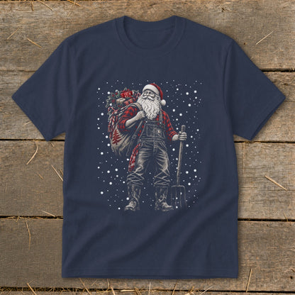 T-shirt graphic of Santa in overalls with a sack and pitchfork, surrounded by snowflakes.