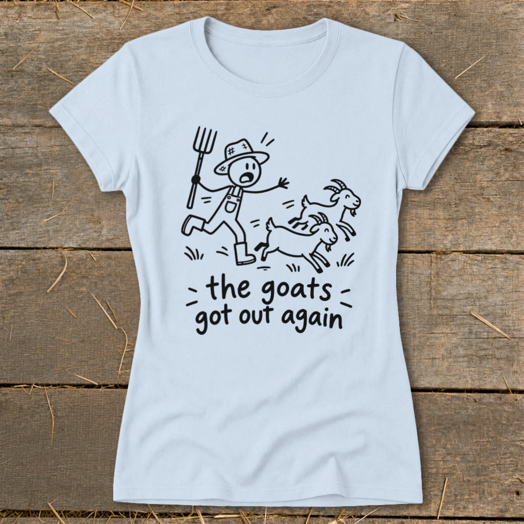 Light blue t-shirt with a cartoon of a farmer chasing goats and text "the goats got out again".