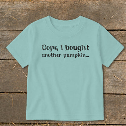 Light blue t-shirt with black text that reads "Oops, I bought another pumpkin..."