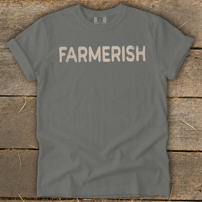 Comfort Colors t-shirt with "FARMERISH" text on a wooden background.
