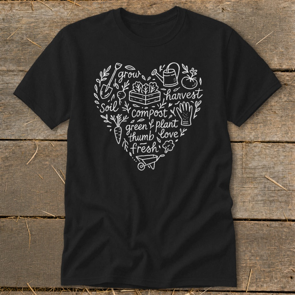 Black t-shirt with white heart graphic of gardening elements and words: grow, harvest, soil, compost, green thumb, plant, love, fresh.
