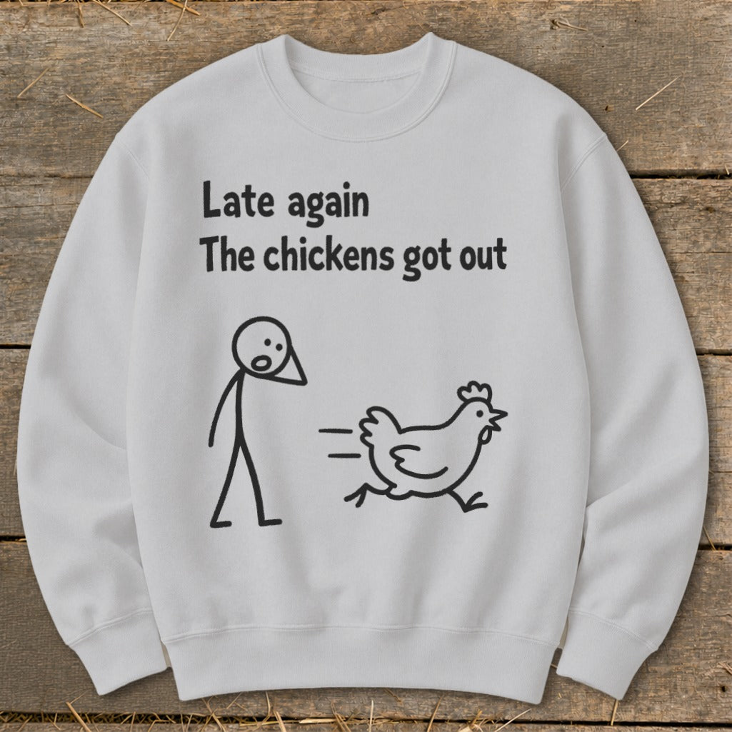 White sweatshirt with stick figure and running chicken graphic and text.