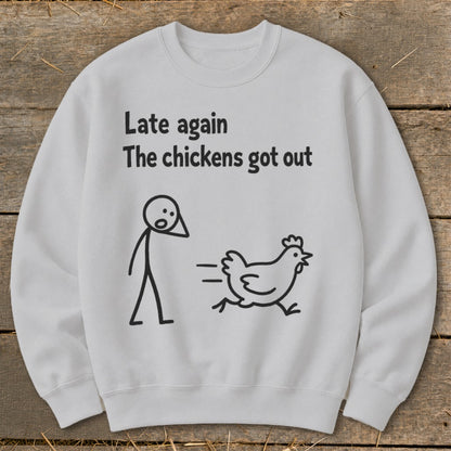 White sweatshirt with stick figure and running chicken graphic and text.