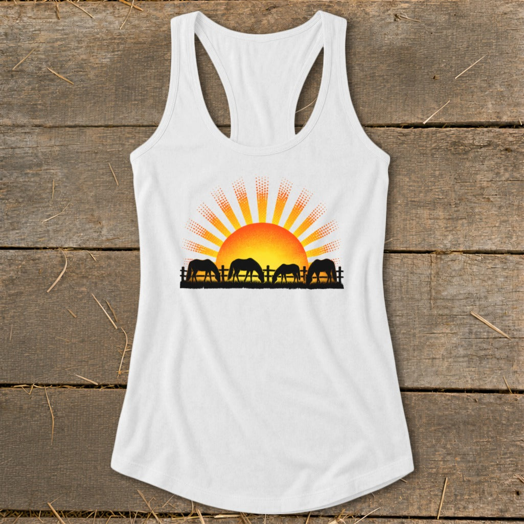 White tank top with a graphic of horses grazing in front of a sunrise.
