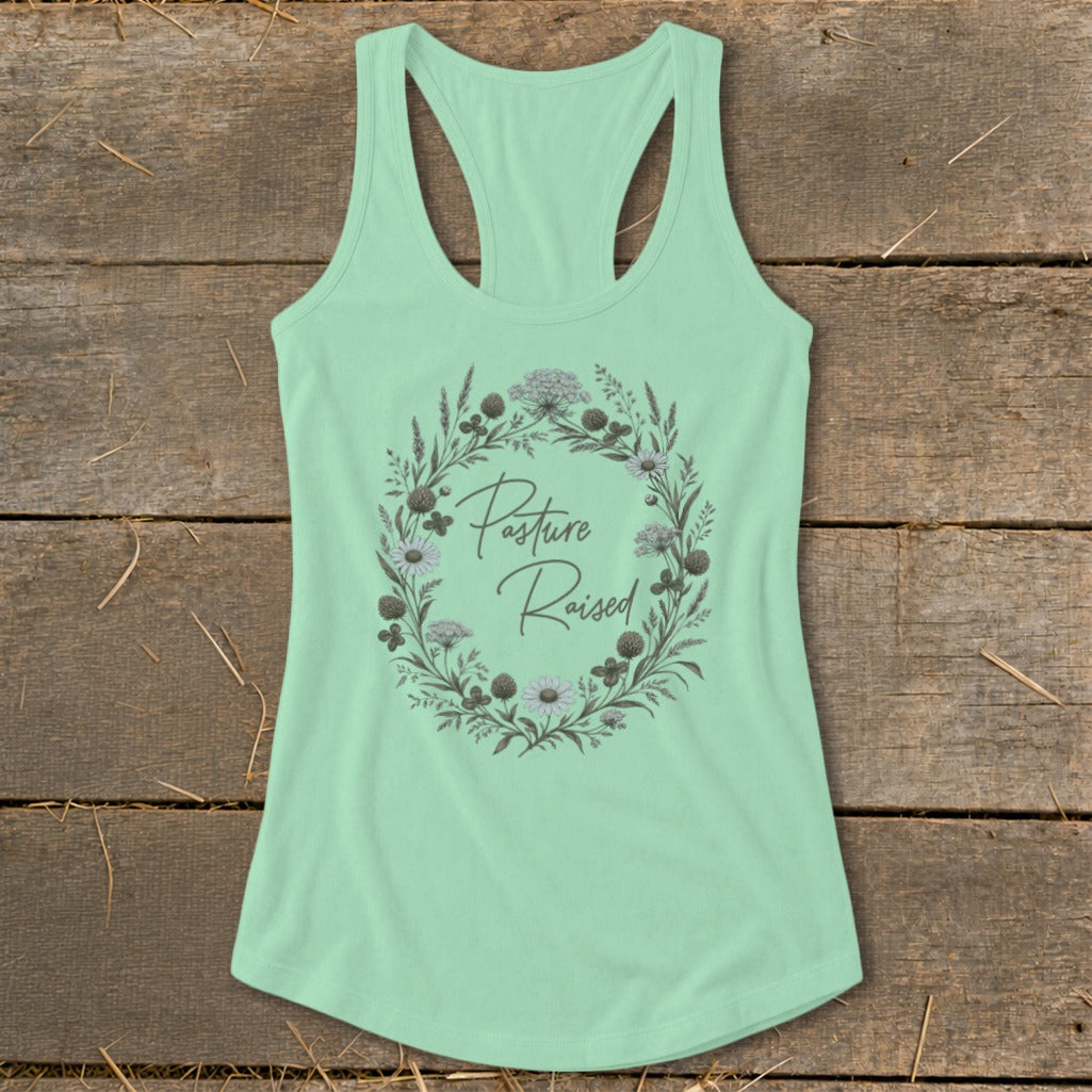 Mint green tank top with "Pasture Raised" text within a floral wreath.