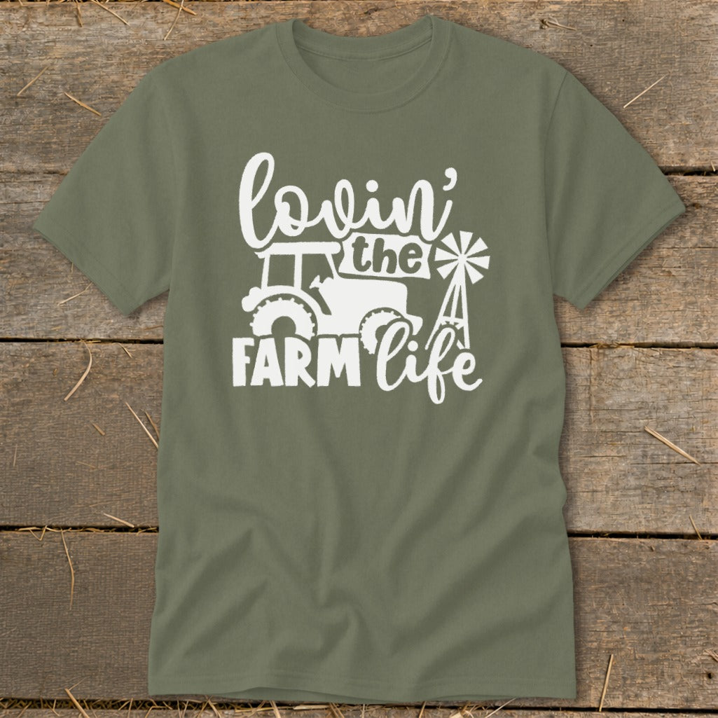 Green t-shirt with white graphic reading "lovin' the FARM life" with tractor and windmill.