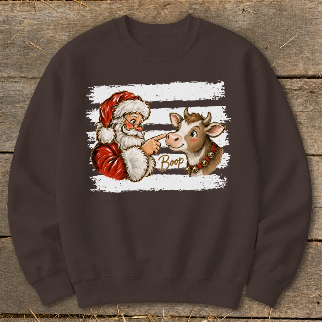 Santa booping a cow's nose with "Boop" text on white stripes.