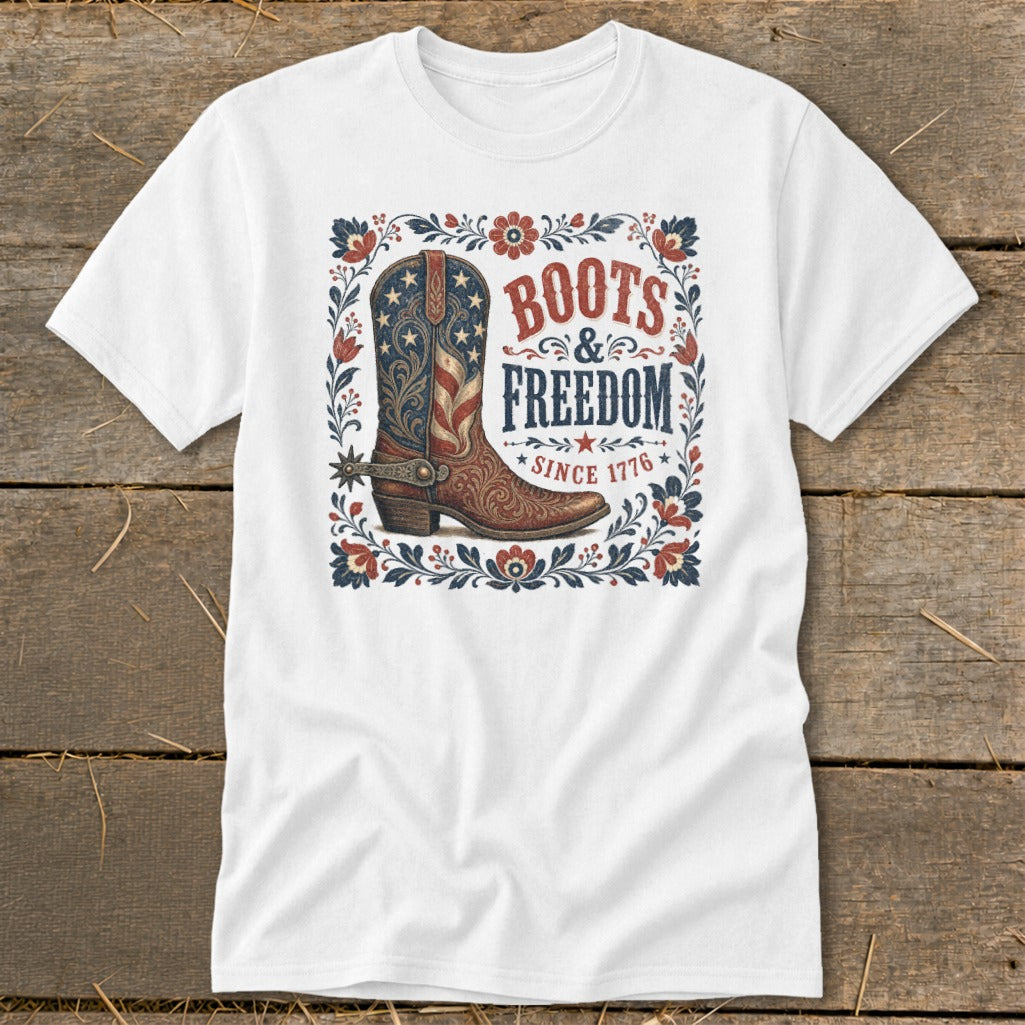 White t-shirt with "Boots & Freedom Since 1776" and American flag cowboy boot.