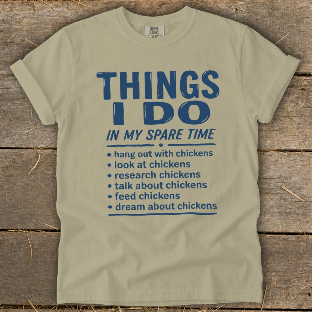 T-shirt with blue text listing chicken-related activities for spare time.
