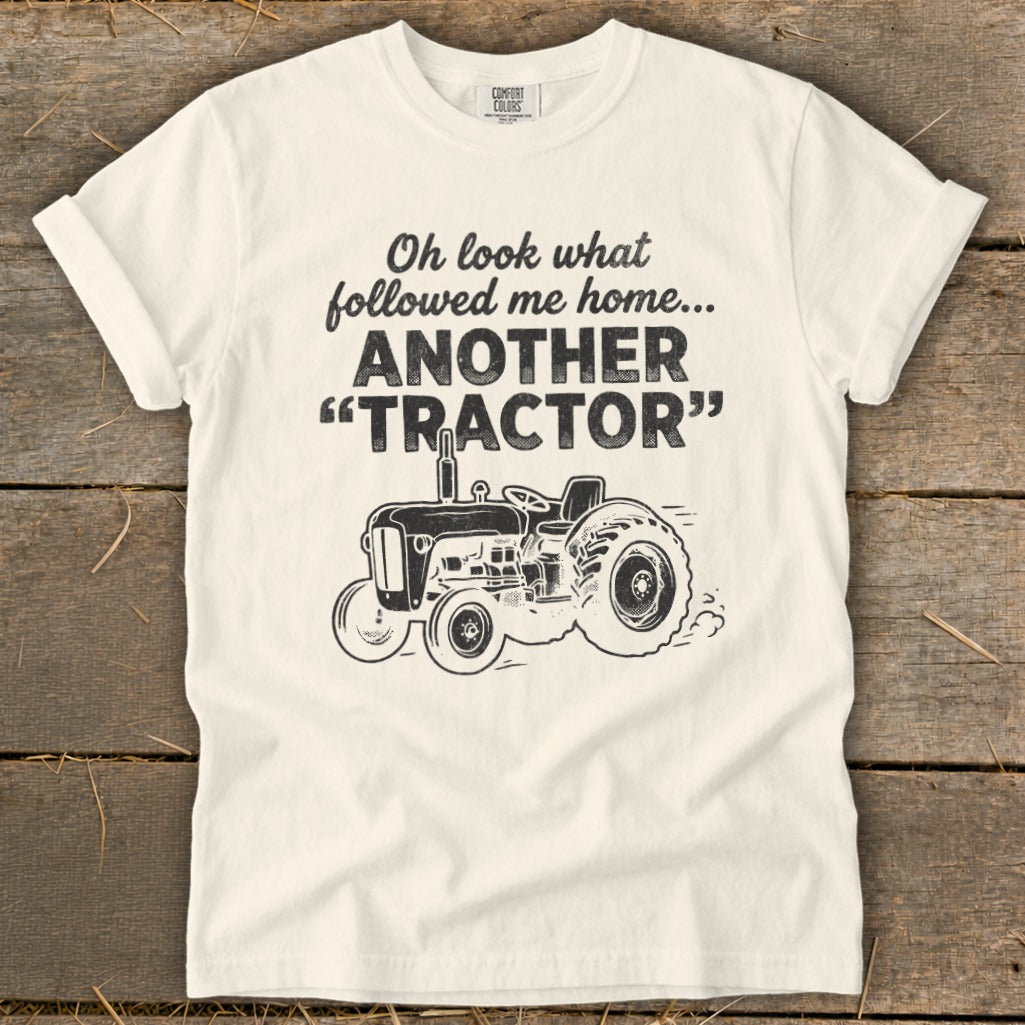 Cream t-shirt with "Oh look what followed me home... ANOTHER 'TRACTOR'" and a tractor graphic.