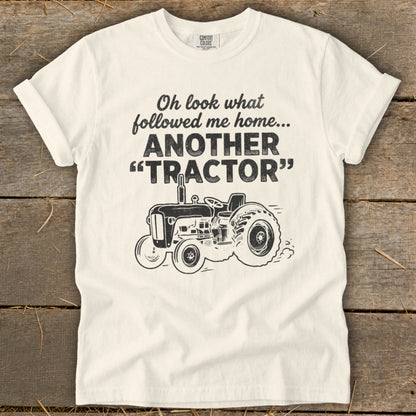 Cream t-shirt with "Oh look what followed me home... ANOTHER 'TRACTOR'" and a tractor graphic.