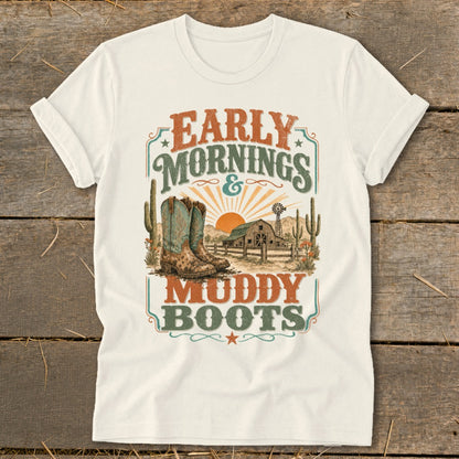 T-shirt with "Early Mornings & Muddy Boots", cowboy boots, barn, and cacti graphic.