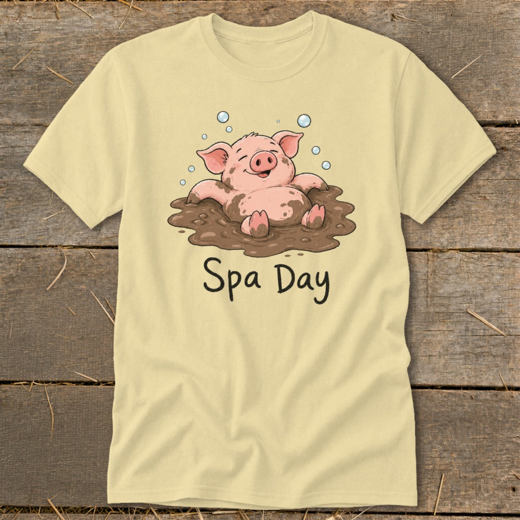 Light yellow t-shirt with a cartoon pig relaxing in mud, text "Spa Day".