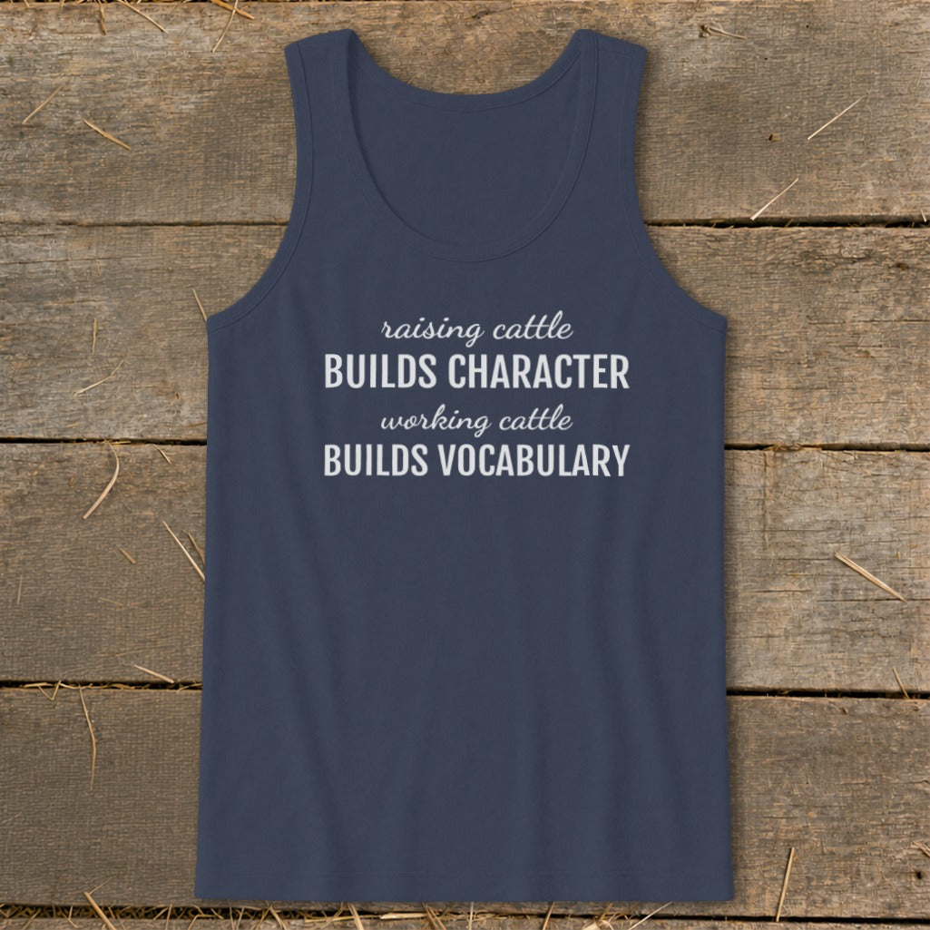 Navy tank top with white text "raising cattle BUILDS CHARACTER working cattle BUILDS VOCABULARY".