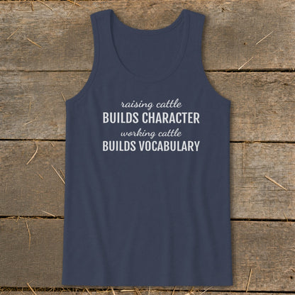 Navy tank top with white text "raising cattle BUILDS CHARACTER working cattle BUILDS VOCABULARY".