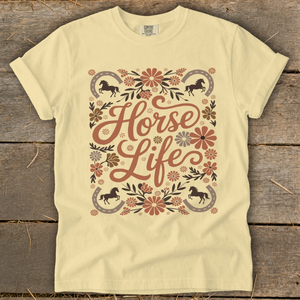 Yellow t-shirt with "Horse Life" text surrounded by floral designs and horseshoes.