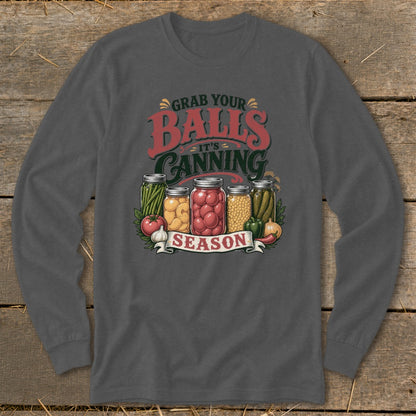 Graphic on dark shirt with jars of canned vegetables and text "Grab Your Balls It's Canning Season".
