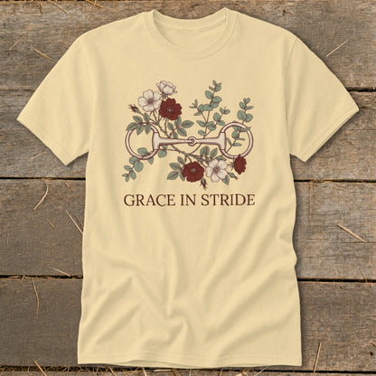Cream t-shirt with horse bit and floral design, "Grace in Stride" text.