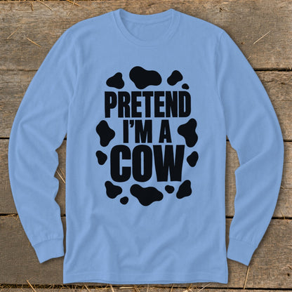 Light blue long-sleeve shirt with "Pretend I'm a Cow" text and black cow spots.