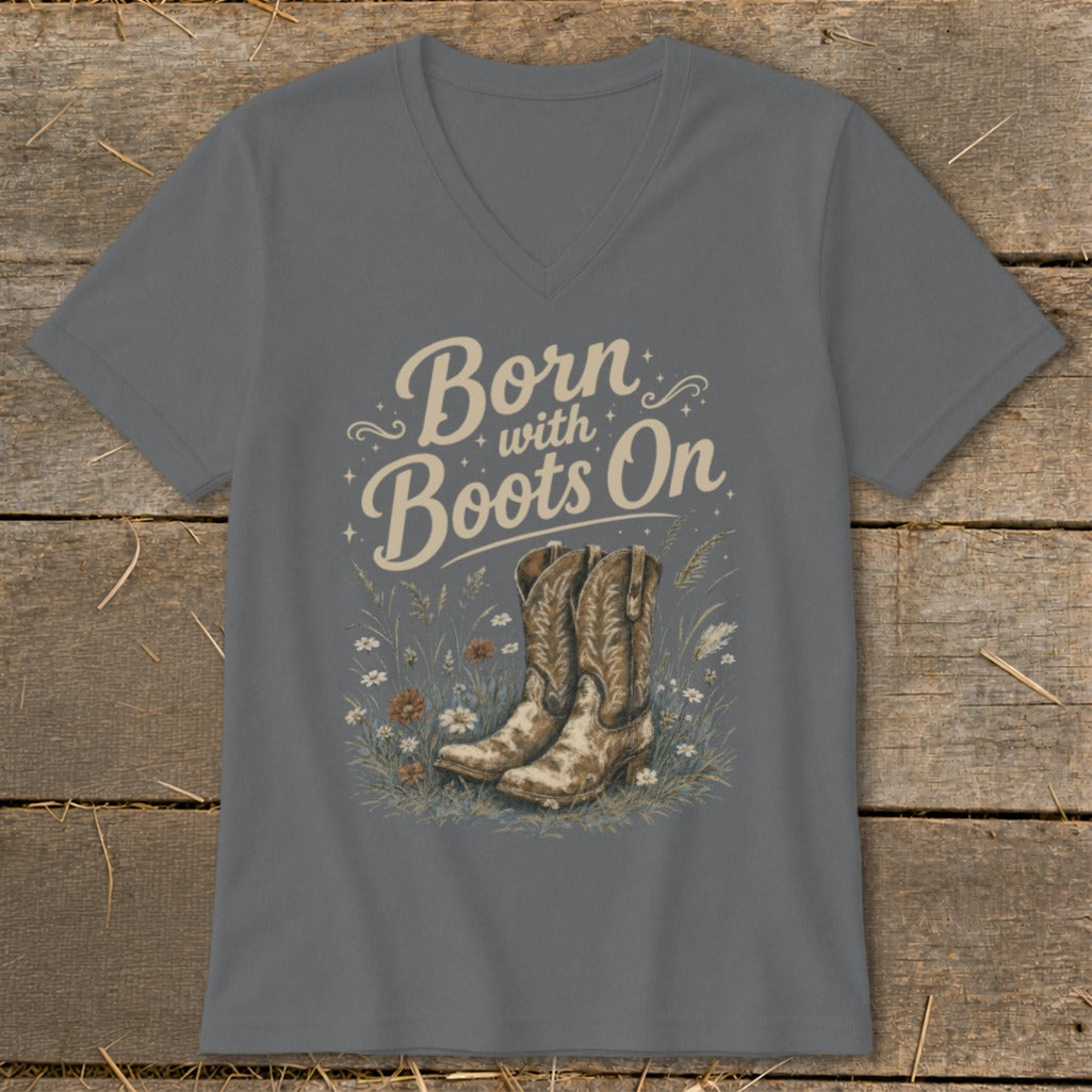 Gray v-neck t-shirt with "Born with Boots On" text and cowboy boots illustration.