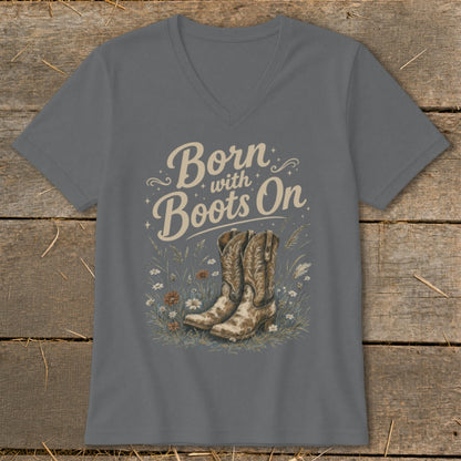 Gray v-neck t-shirt with "Born with Boots On" text and cowboy boots illustration.