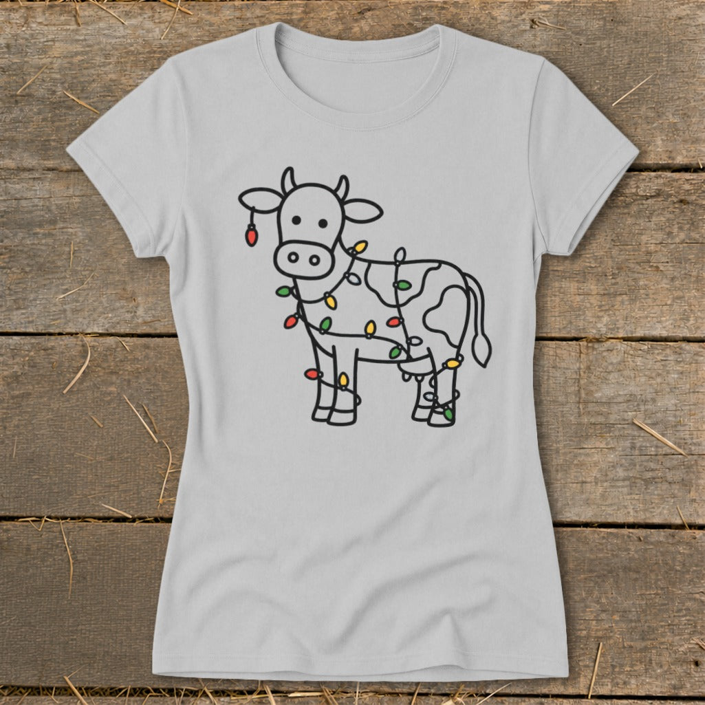 Light gray t-shirt with a black outline drawing of a cow wrapped in colorful Christmas lights.