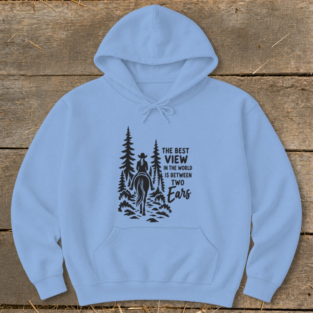 Light blue hooded sweatshirt with a black graphic of a horseback rider and text reading The Best View in the World is Between Two Ears.